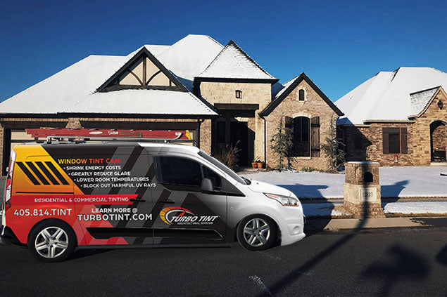 Turbo Tint van in front of residential home